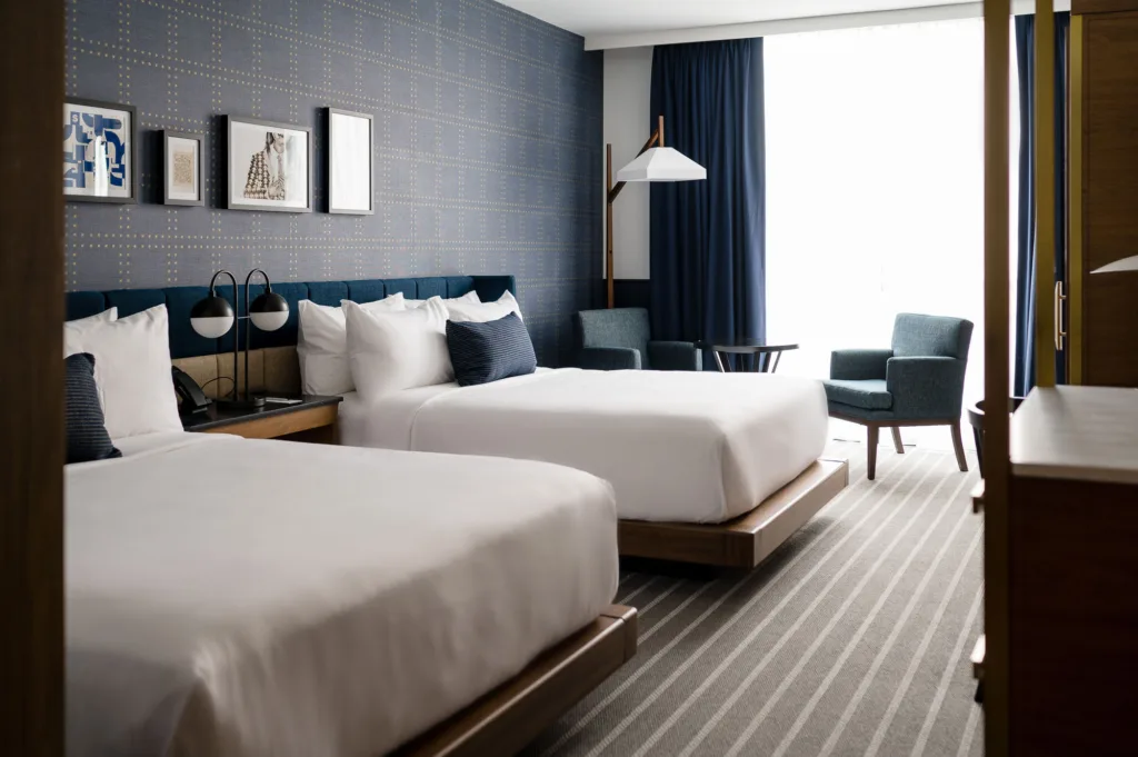 Somerville, Mass. hotel room with two beds and floor-to-ceiling windows