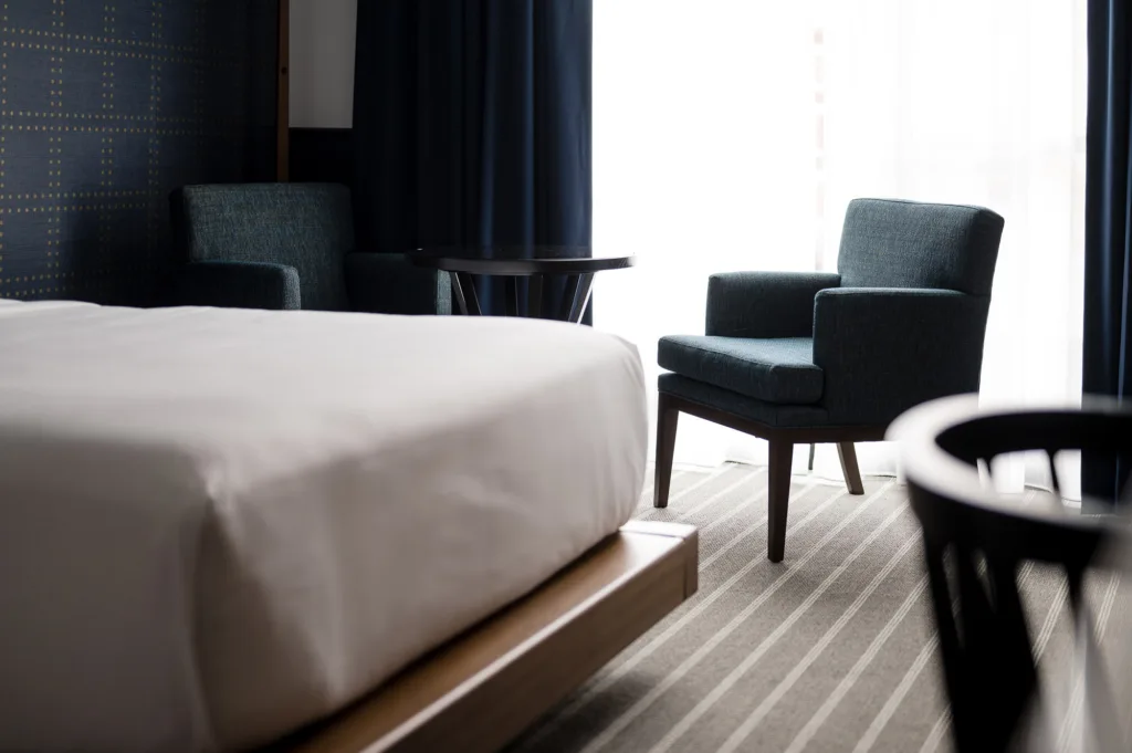 Artistic shot of lounge chairs and a table at our Somerville-Boston hotel