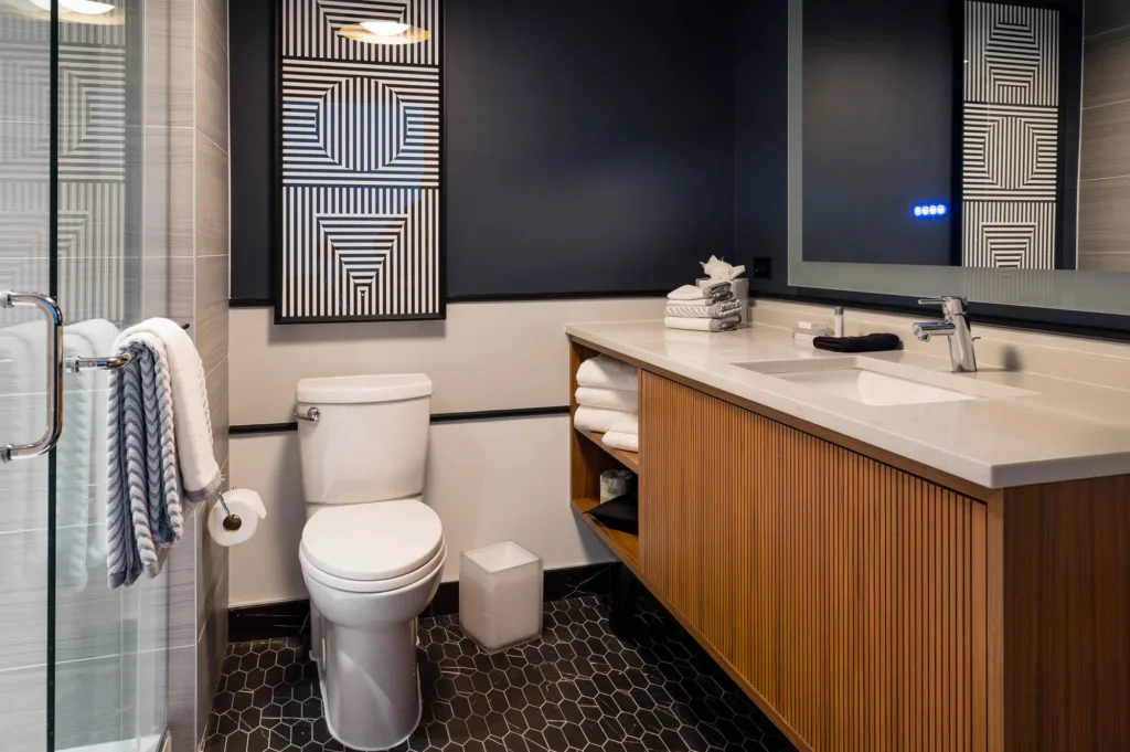 Somerville, Mass. hotel bathroom with a glass shower and large counter