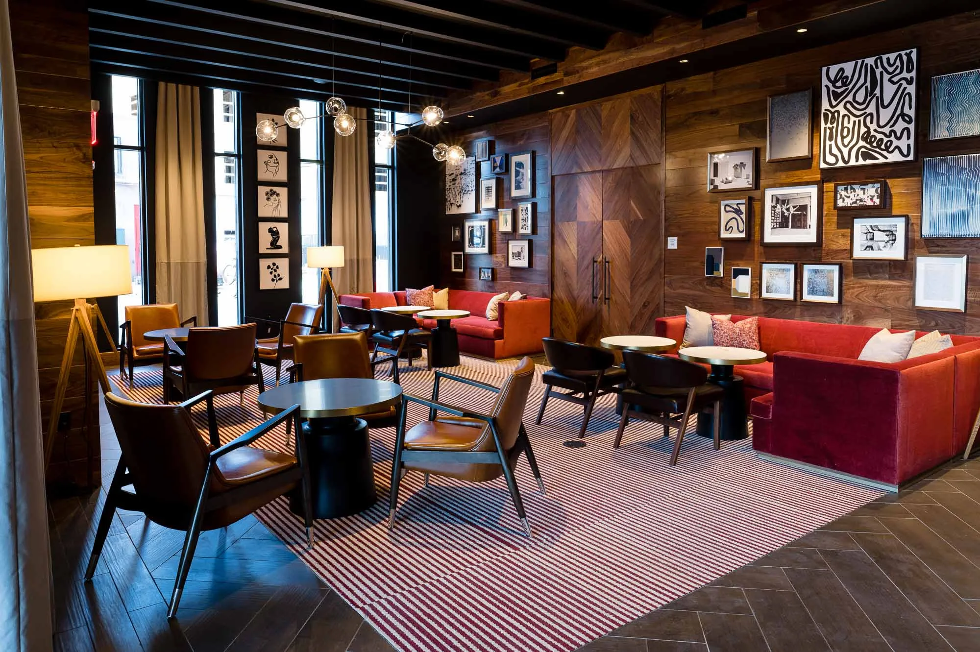 Lounge area at Cambria in Somerville-Boston with seating and tables