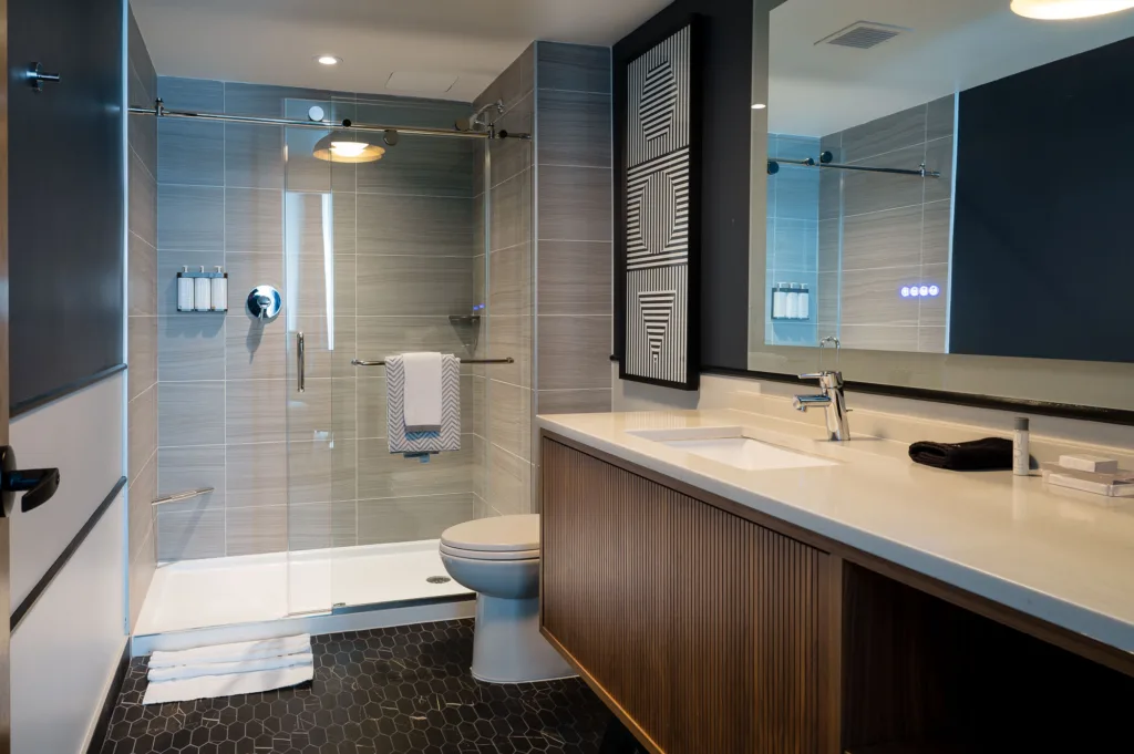 Glass shower, toilet, and a large counter at our hotel near Boston, Mass.