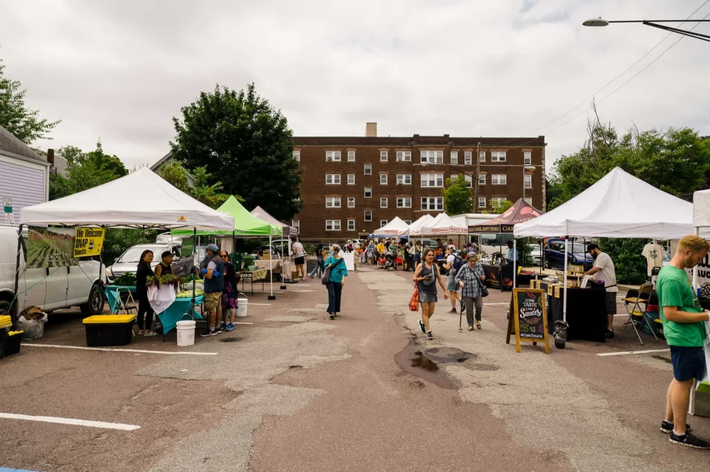 People shopping outdoors at Bow Market in Somerville, MA