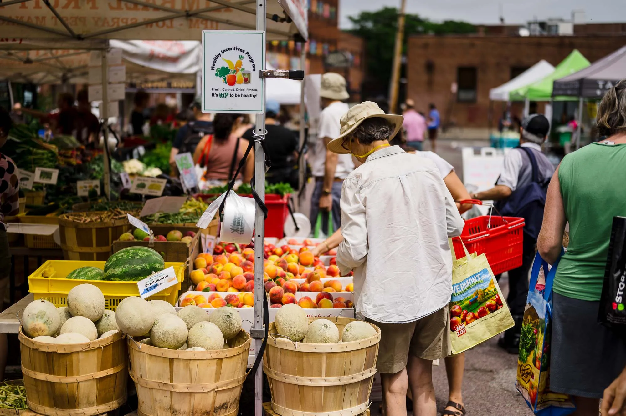 People selecting fresh fruit at Bow Market in Somerville, MA