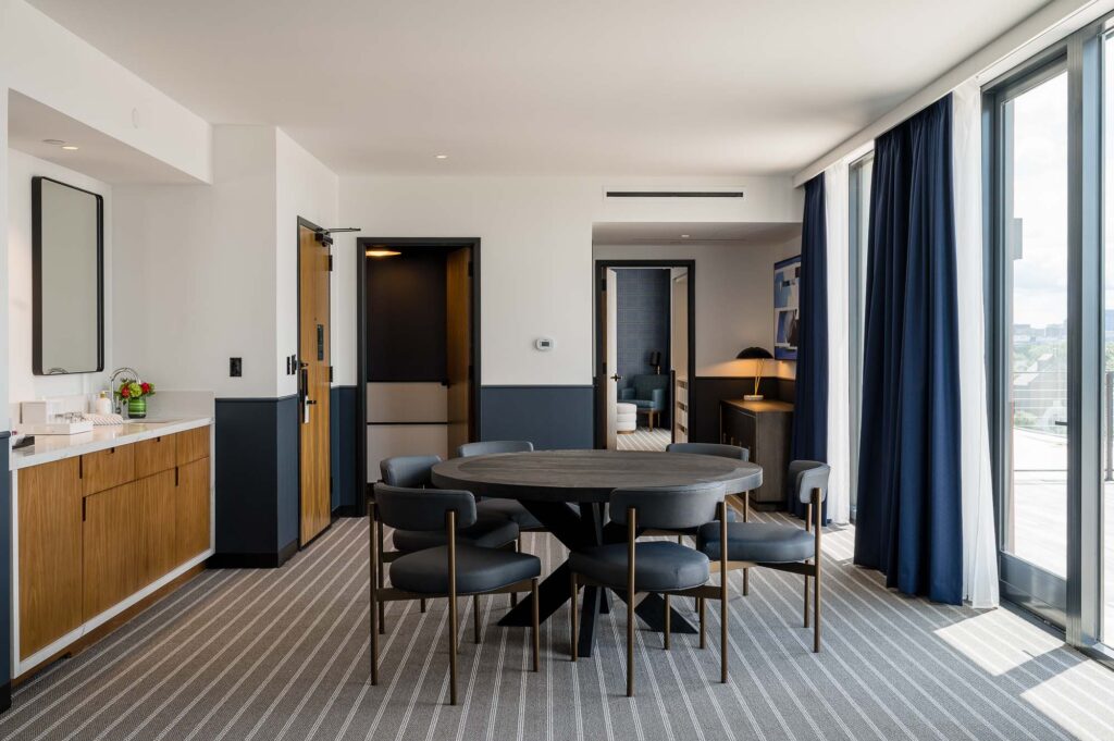 Suite at Cambria hotel in Somerville-Boston with a large dining area