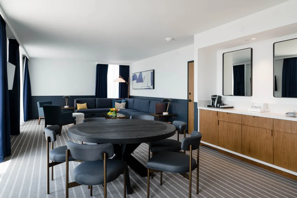 Large seating and dining areas in a room at our hotel near Boston, Mass.