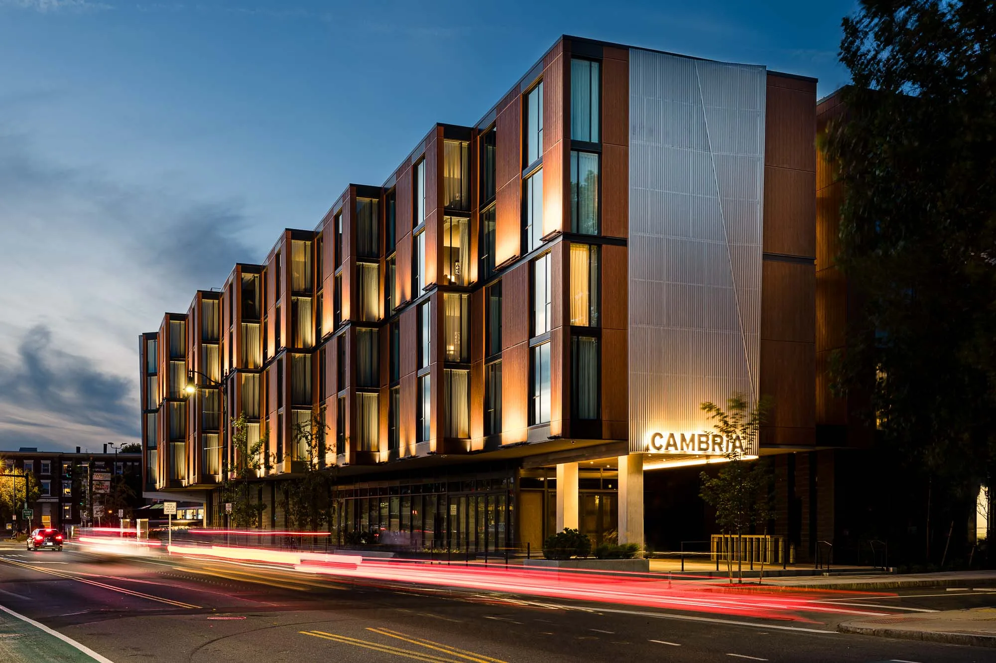 Nighttime exterior view of Cambria's hotel in Somerville-Boston