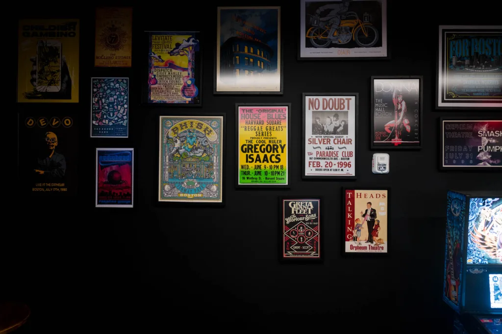 Music posters decorating a wall at a Somerville record store