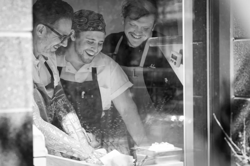 chefs laughing in Josephine at Cambria Hotel in Somerville