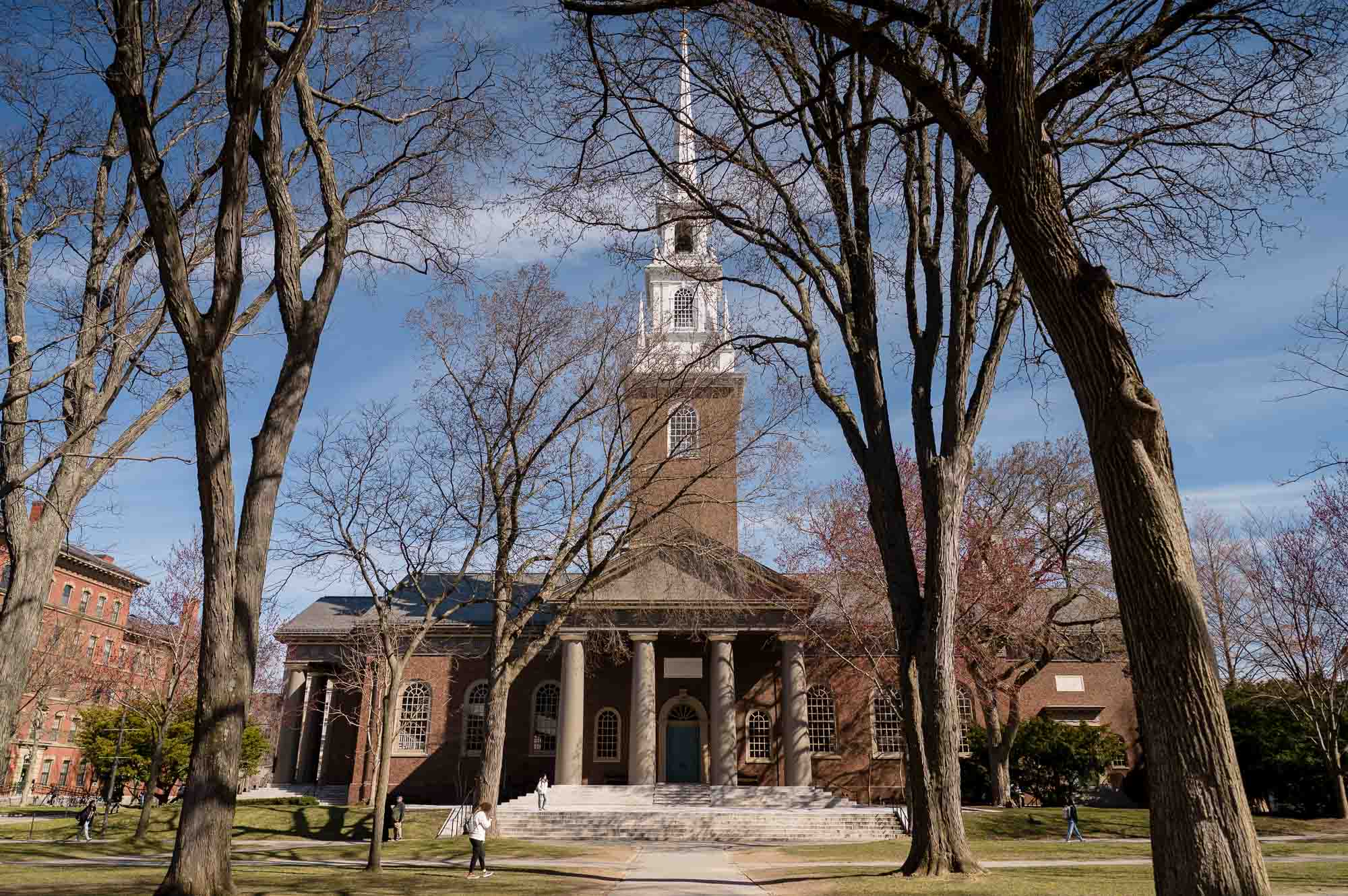 Exterior view of Harvard Memorial Church, behind leafless trees