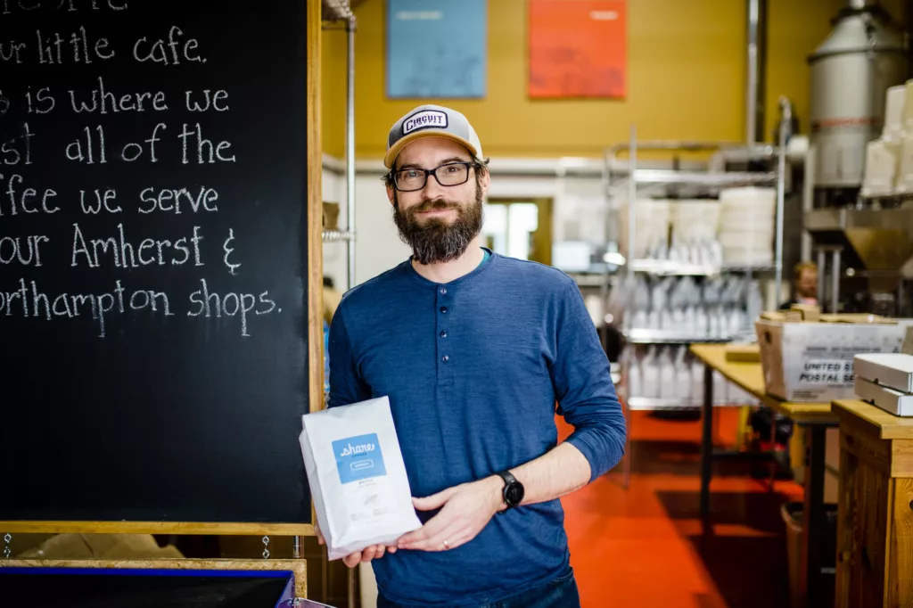 Man posing at Share Coffee Roasters, an independent coffee roaster