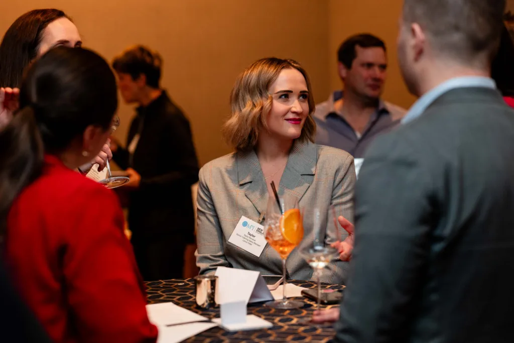 Guests mingling during an event at Cambria Hotel Boston-Somerville